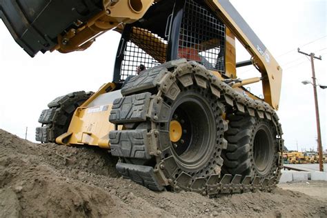 skid steer tracks vs wheels with tracks over|bobby ford wheel skid steer.